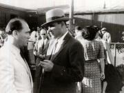 Gheorghe Gheorghiu –Dej pe Aeroportul Băneasa înainte de plecare la Conferinţa de Pace de la Paris, întreţinându-se cu Teohari Georgescu. (11.08.1946).