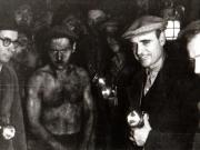 Gheorghe Gheorghiu-Dej printre muncitorii mineri în minele de la Petrila, la 300 m adâncime (1944 noiembrie 23).
