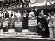 Gh.Gheorghiu Dej, rostindu-şi cuvântarea la Congresul Frontului Plugarilor, ţinut pe Stadionul A.N.E.F. din Capitală la 24 iunie 1945 (Romulus Zăroni, Petru Groza, Mihai Ralea).(24 iunie 1945)