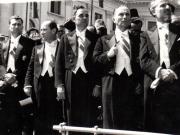 Gheorghe Gheorghiu Dej, L.Rădăceanu, Ştefan Voitec şi alte persoane în tribuna din Piaţa Palatului R.P.R. primind defilarea trupelor cu prilejul zilei de 23 august 1945 (Lucreţiu Pătrăşcanu, Teohari Georgescu).(23 august 1945)