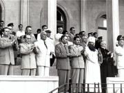 Gheorghe Gheorghiu –Dej, Al. Moghioroş, P. Groza, E. Bodnăraş, C.I. Parhon, Chivu Stoica, I. Chişinevschi, Al. Drăghici, Gh. Apostol, Leonte Răutu, Gh. Stoica, Dumitru Petrescu, Petre Borilă, Patriarh M. Justinian, M. Constantinescu, D. Colin, C. Pârvulescu în tribuna oficială de pe stadionul „23 August” din Capitală cu prilejul deschiderii Festivalului Mondial al Tineretului.(2.08.1953).